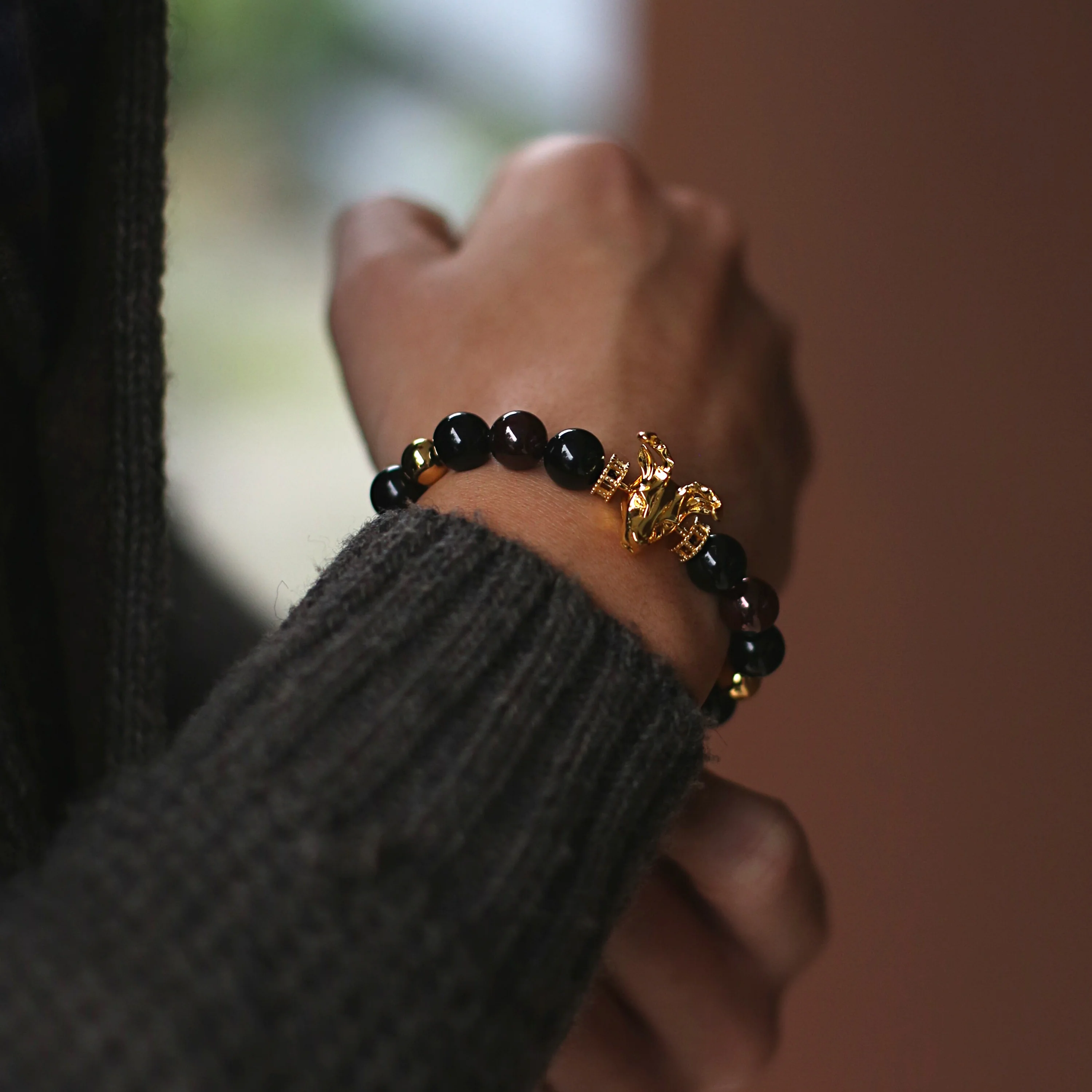 Gold Deer, obsidian, garnet bracelet with gold connector - Image 2